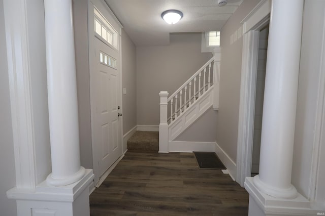 entrance foyer with dark hardwood / wood-style floors