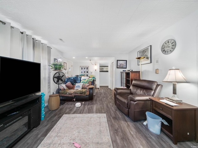 living room with dark hardwood / wood-style flooring