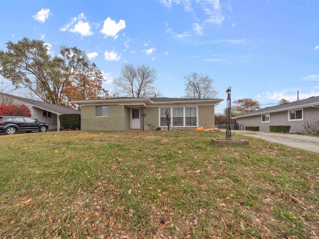 ranch-style house with a front lawn