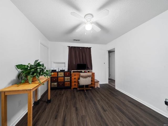 office space featuring ceiling fan, a textured ceiling, and dark hardwood / wood-style floors