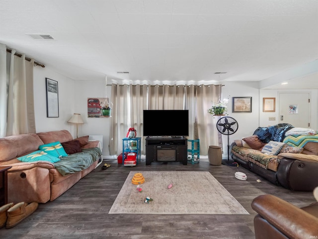 living room featuring dark wood-type flooring