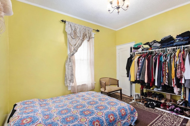 bedroom featuring ornamental molding and a textured ceiling