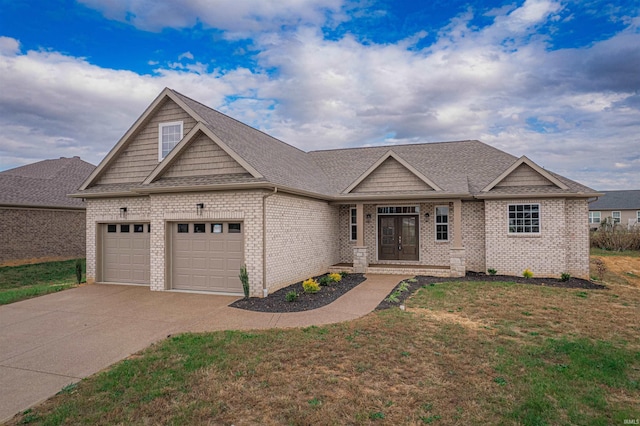 craftsman-style home featuring a garage and a front yard