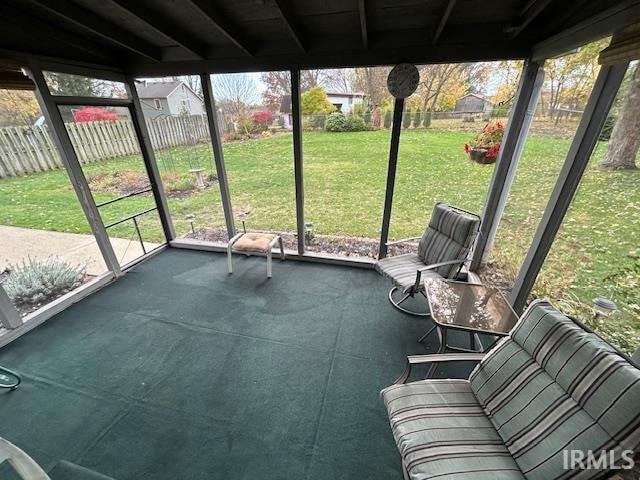 unfurnished sunroom with plenty of natural light