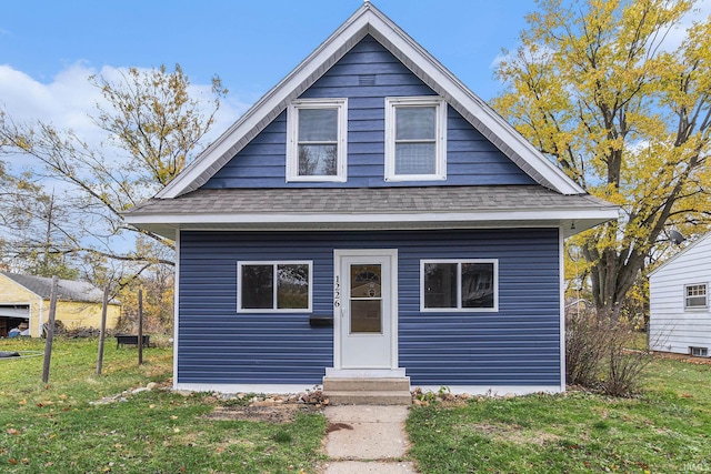 bungalow with a front yard