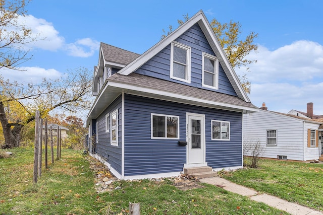 bungalow with a front yard