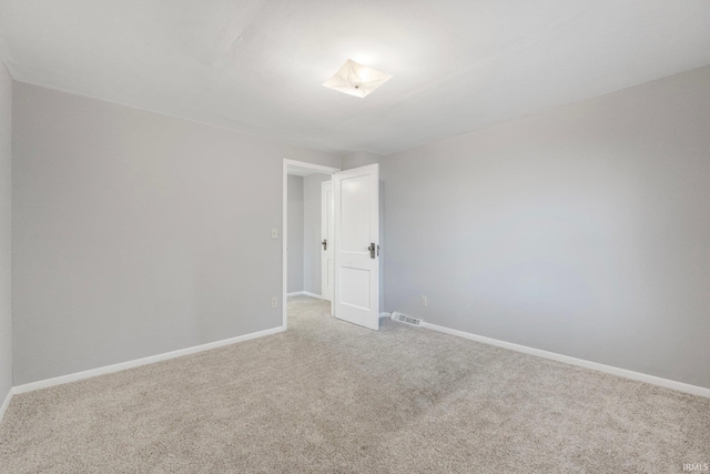 unfurnished room featuring carpet flooring