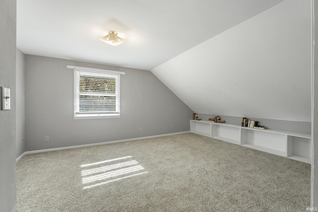 bonus room featuring carpet flooring and lofted ceiling