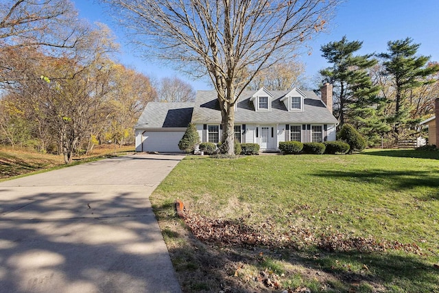 cape cod house featuring a garage and a front yard