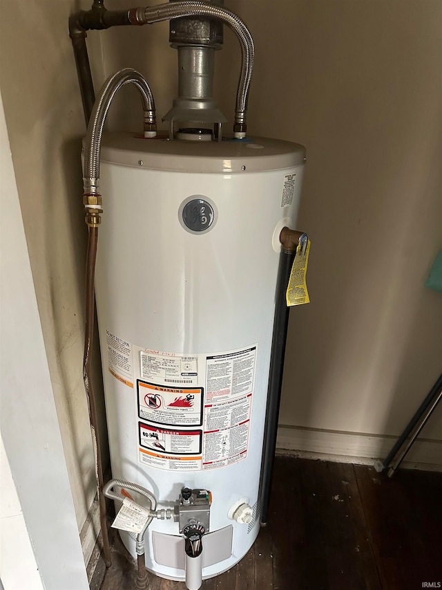 utility room featuring gas water heater