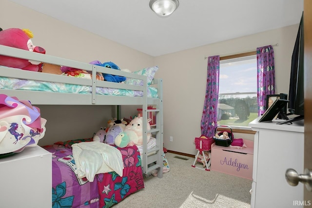 bedroom with light carpet