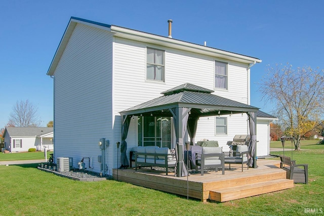 back of house with a wooden deck, cooling unit, a lawn, and a gazebo