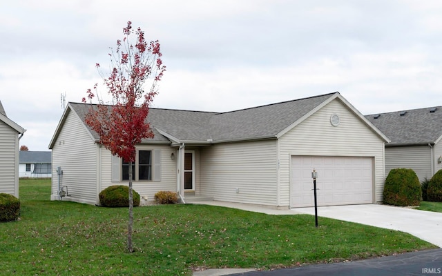 ranch-style house with a garage and a front lawn