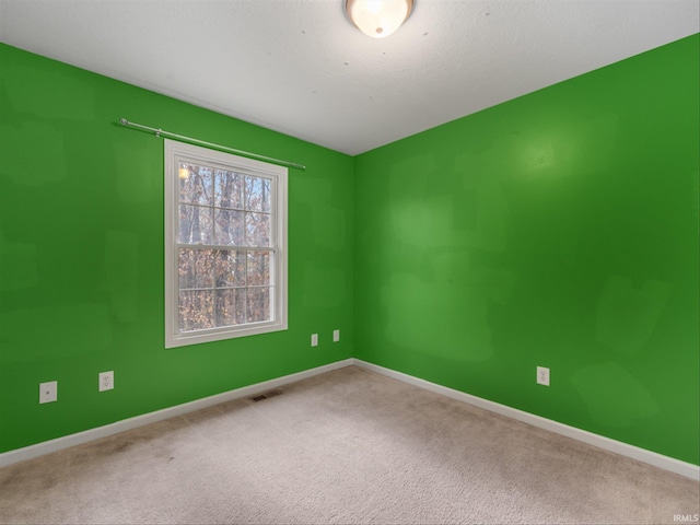 empty room featuring carpet