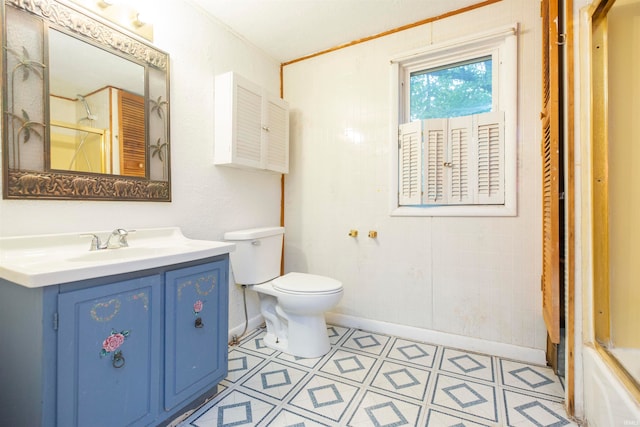 full bathroom featuring bath / shower combo with glass door, vanity, toilet, and tile patterned floors