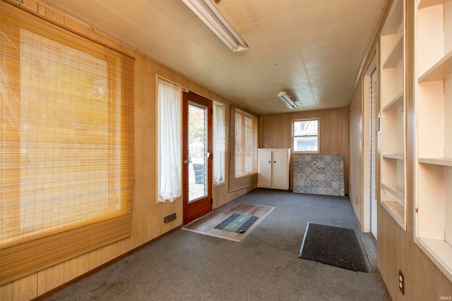 unfurnished sunroom featuring a healthy amount of sunlight