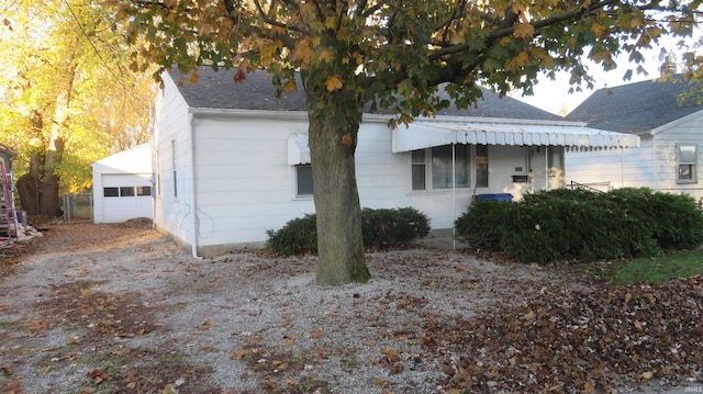 view of side of property featuring a garage