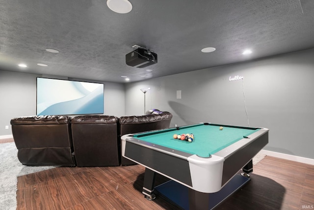 rec room featuring dark wood-type flooring, a textured ceiling, and billiards