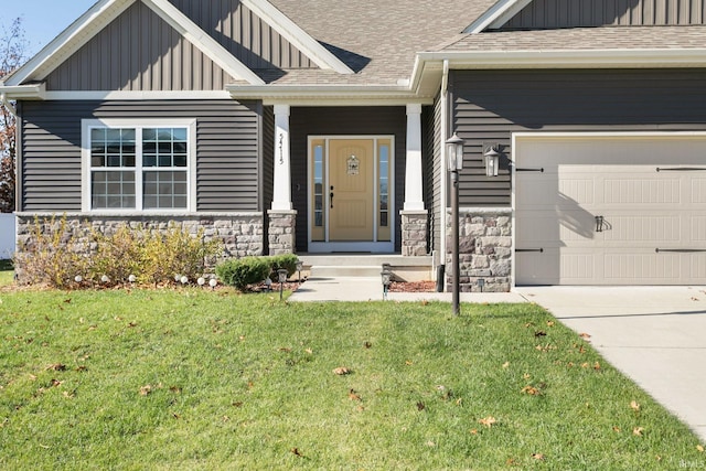 view of exterior entry featuring a yard