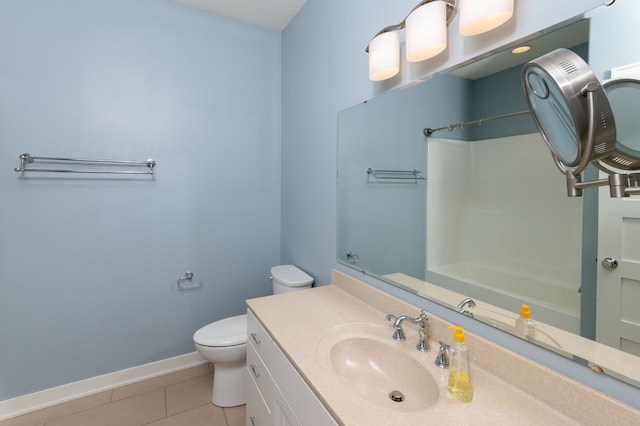 bathroom with toilet, vanity, tile patterned floors, and a shower