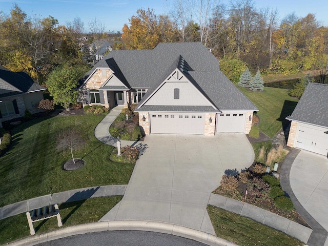 view of front of property with a garage and a front yard