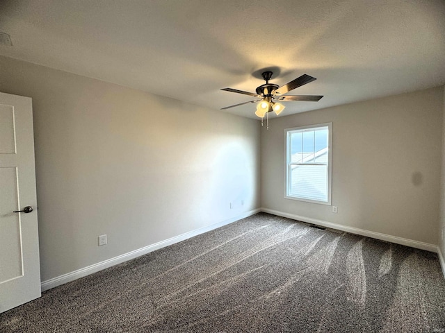 spare room featuring carpet flooring, baseboards, and a ceiling fan