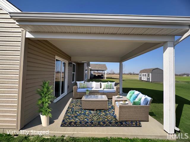 view of patio / terrace featuring an outdoor living space, a storage unit, and an outdoor structure