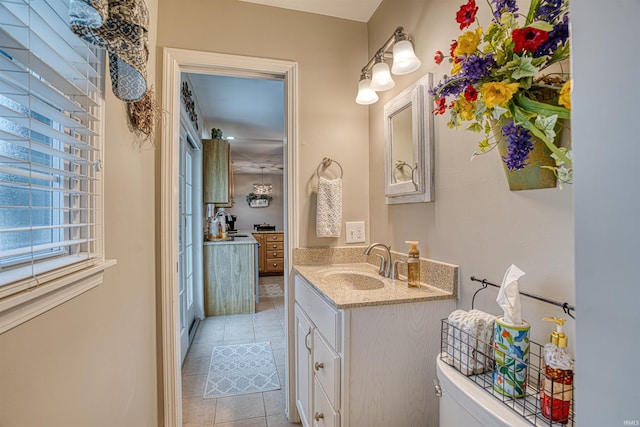 bathroom featuring tile patterned floors, vanity, and toilet