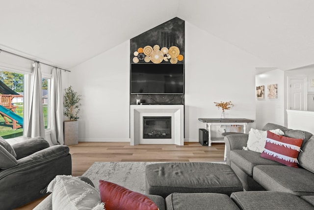 living room featuring hardwood / wood-style floors and lofted ceiling