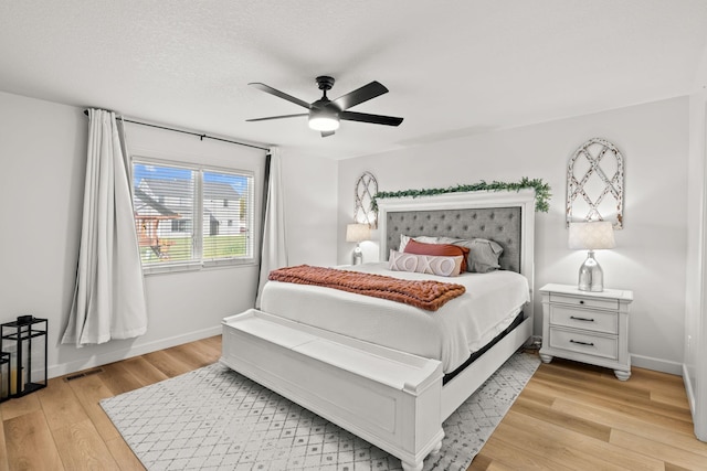 bedroom featuring light wood-type flooring and ceiling fan