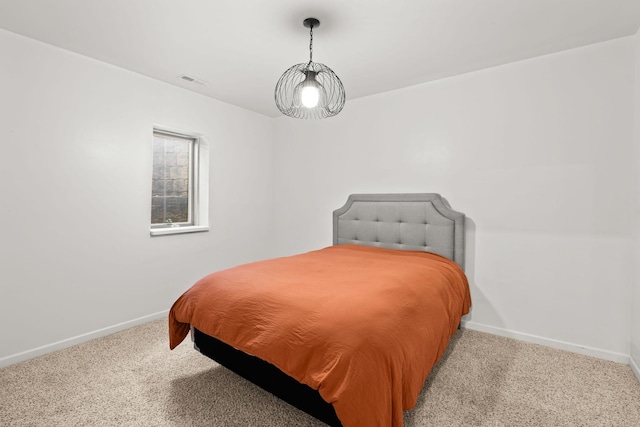 bedroom with light colored carpet