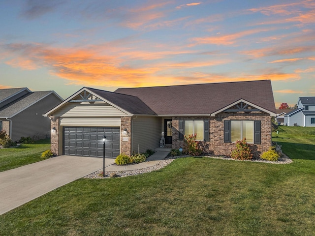 view of front facade featuring a garage and a yard