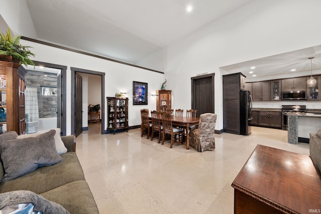 living room with a high ceiling