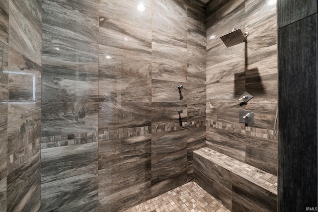 bathroom featuring a tile shower