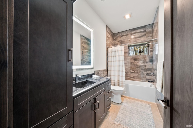 full bathroom featuring toilet, shower / bath combo, and vanity