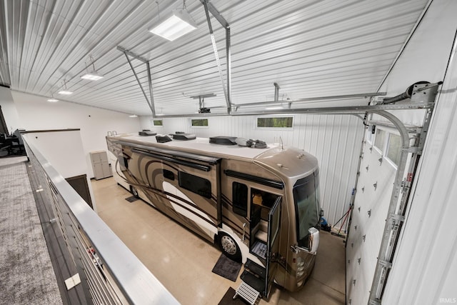 garage featuring wood walls