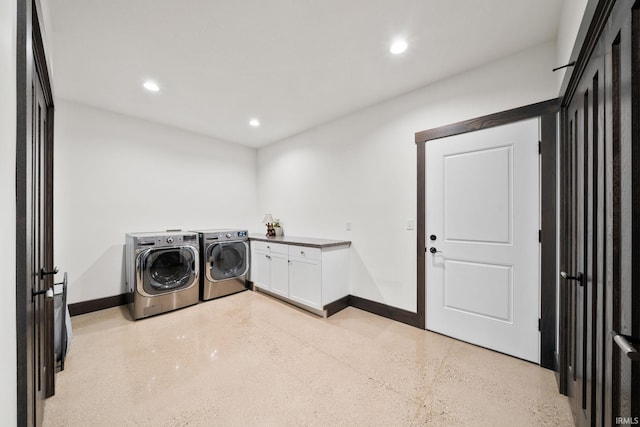 laundry room with cabinets and independent washer and dryer