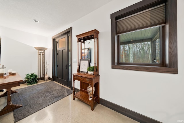 foyer featuring a textured ceiling