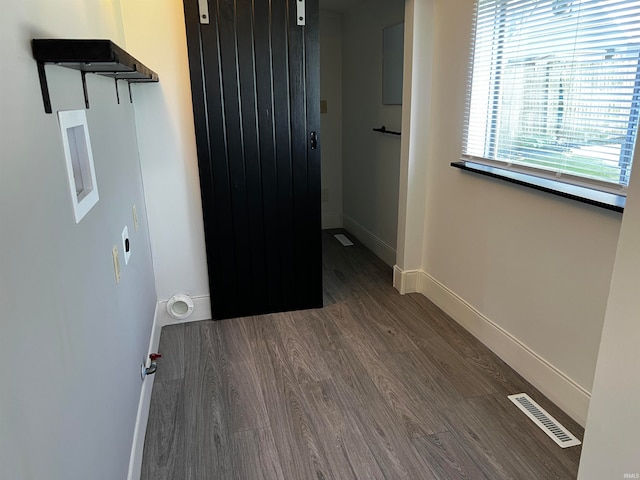 laundry room with dark hardwood / wood-style flooring