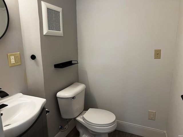 bathroom with toilet and vanity