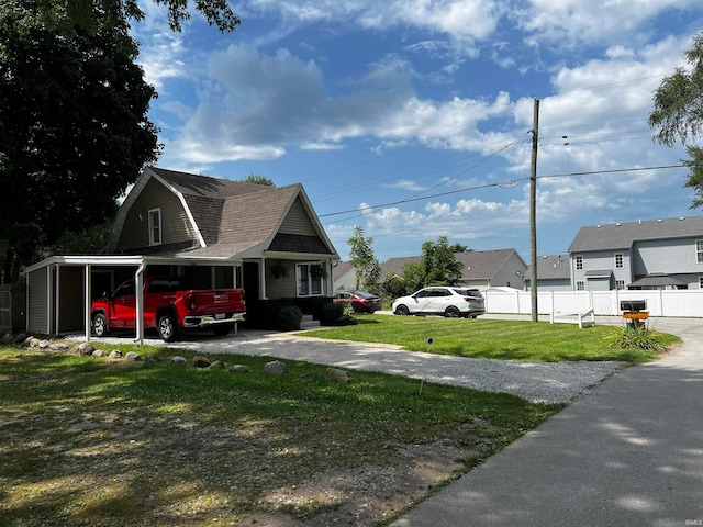 exterior space with a carport and a yard