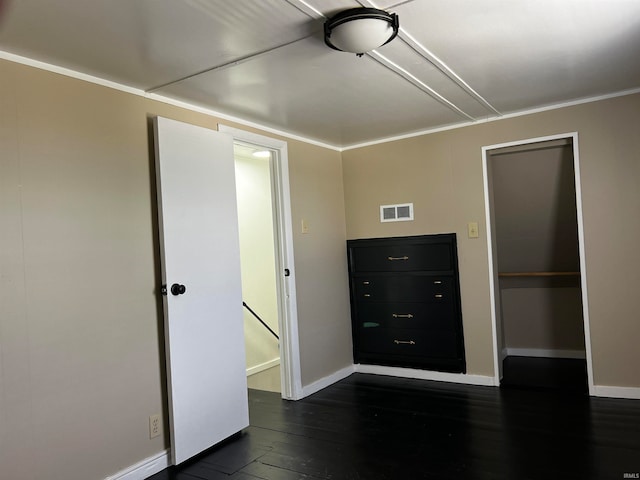 unfurnished bedroom featuring dark hardwood / wood-style floors