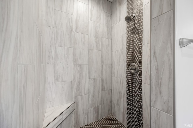 bathroom featuring tiled shower