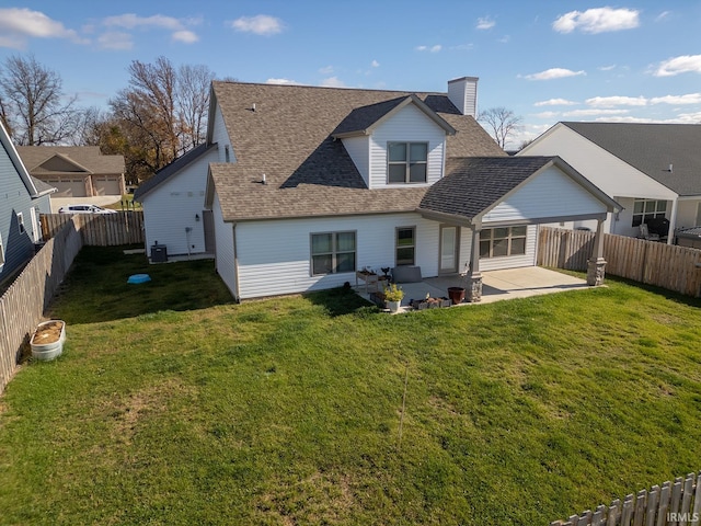 rear view of house with central AC unit, a yard, and a patio area