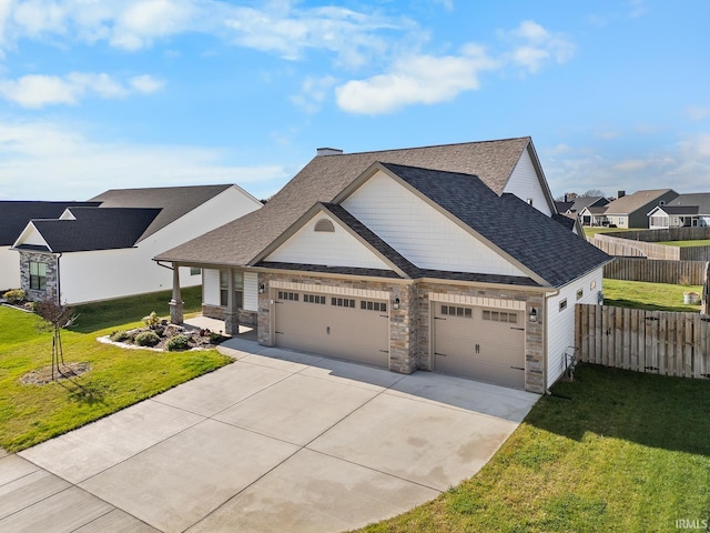 view of front of house with a garage and a front yard