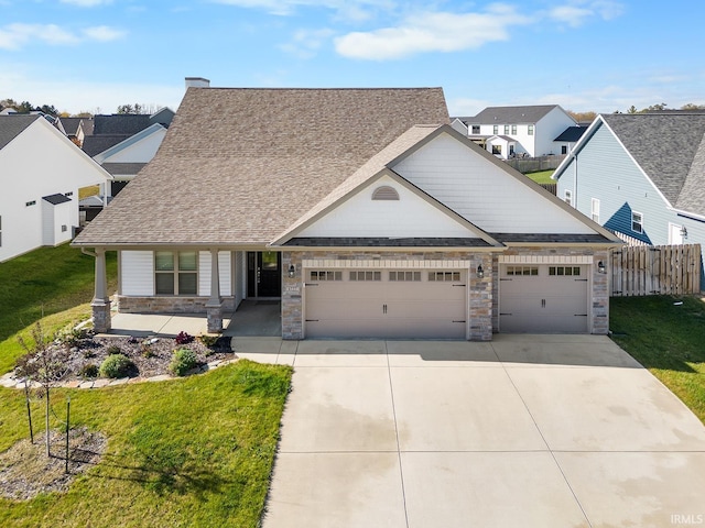 craftsman house with a garage, a front lawn, and a porch