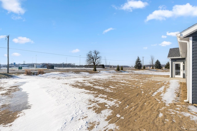 view of yard layered in snow