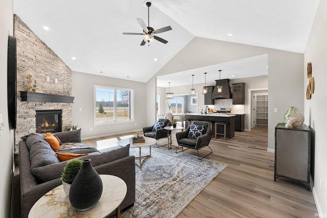 11903 Cross Winds Way, Fort Wayne, IN 46818 - living room featuring ceiling fan, high vaulted ceiling, light wood finished floors, a fireplace, and recessed lighting