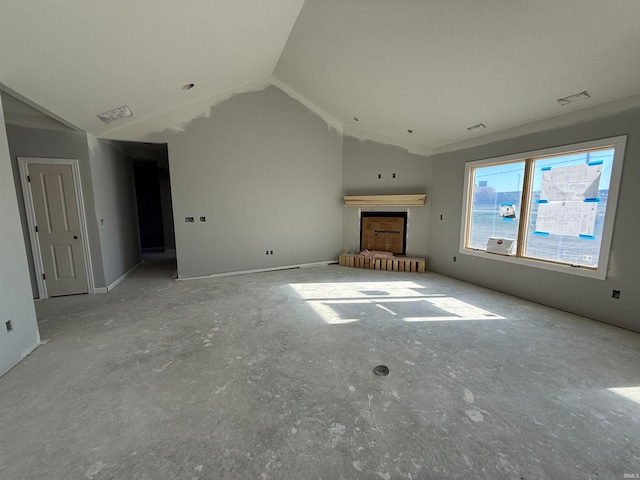 unfurnished living room featuring lofted ceiling