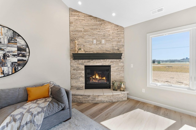 11903 Cross Winds Way, Fort Wayne, IN 46818 - living area with wood finished floors, vaulted ceiling, a fireplace, and recessed lighting